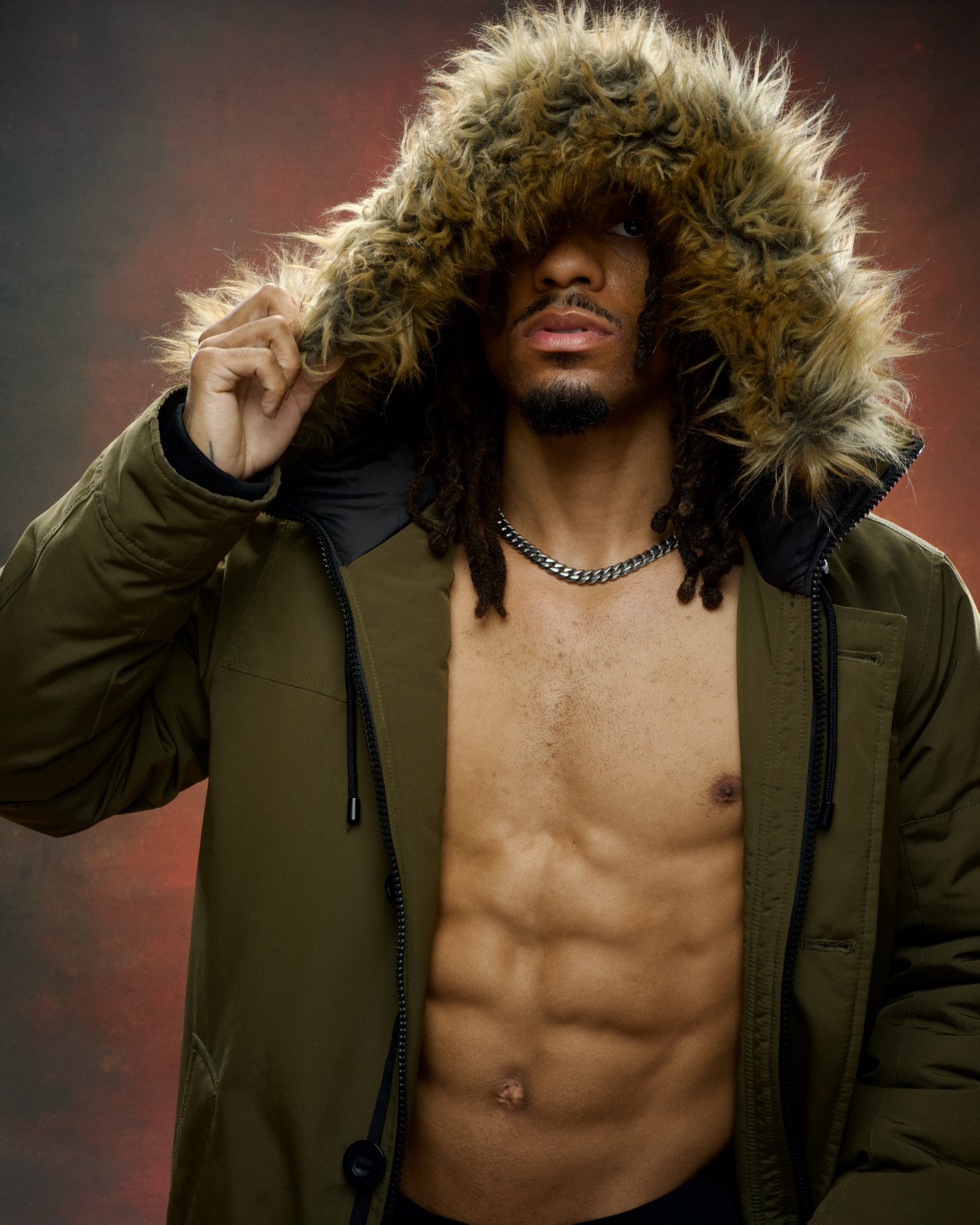 Boxer Jordan King in fur-lined parka, studio portrait at the Uptown Loft.